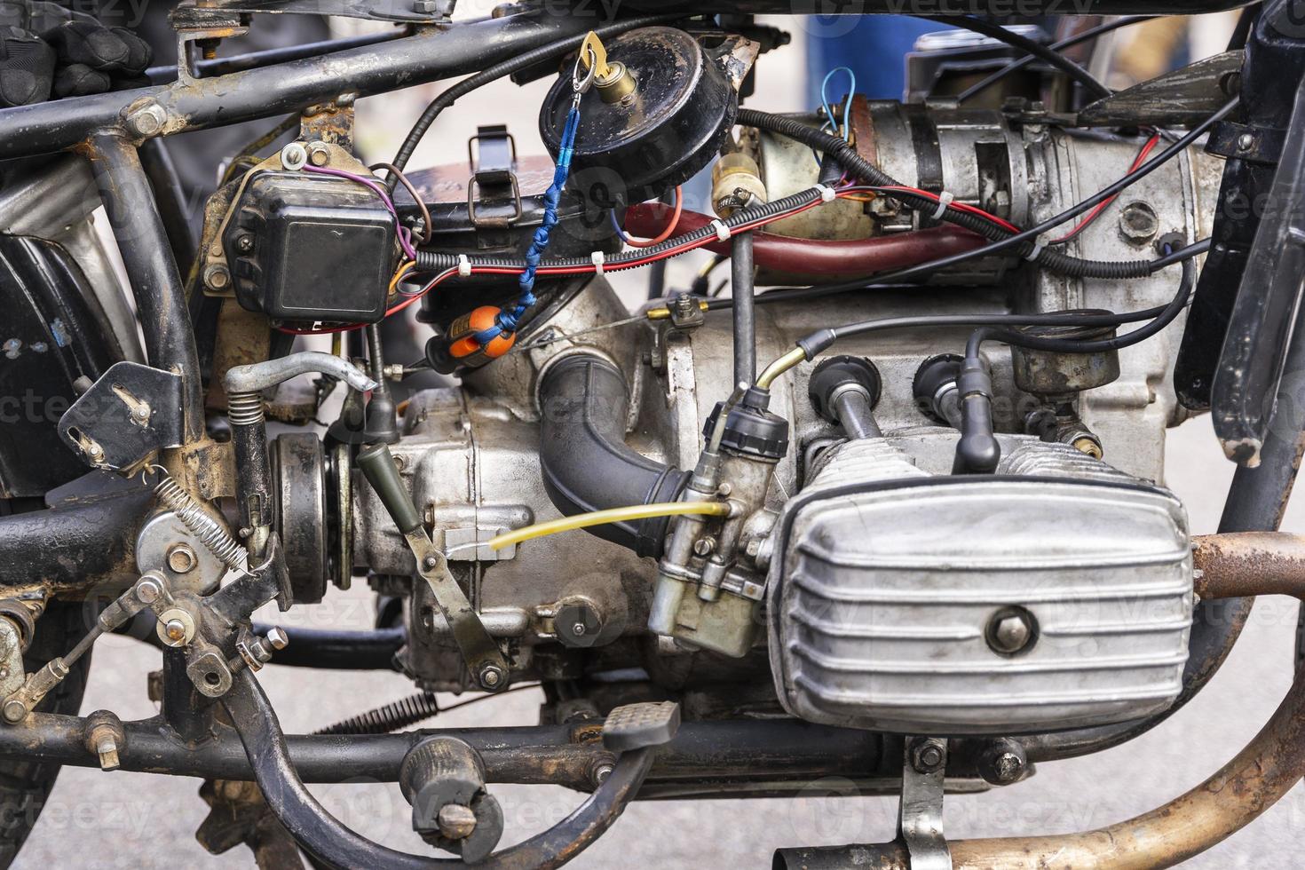 The opposition carburetor engine of an old motorcycle, old motor of the motorcycle close up photo