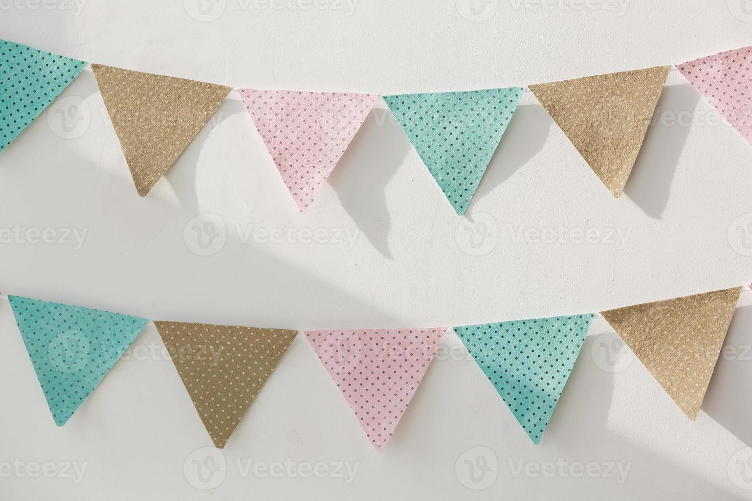 Colorful party flags isolated on white background, birthday, anniversary, celebrate event, festival greeting card background photo