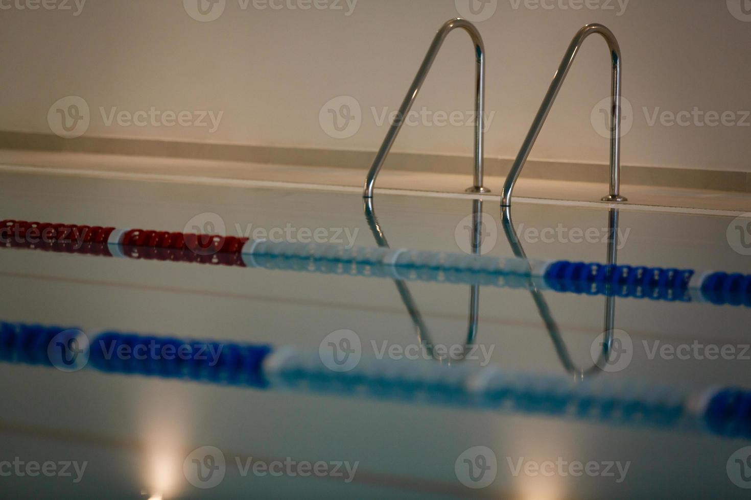 Pool metal stairs close up photo