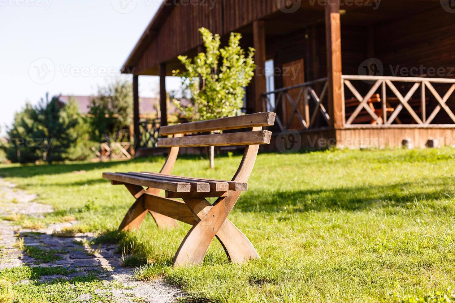 Wooden bench in the park photo