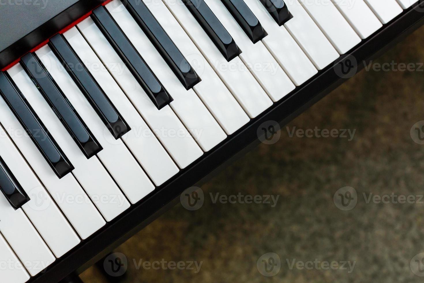 Black and white piano keys with written notes top view the concept of music photo