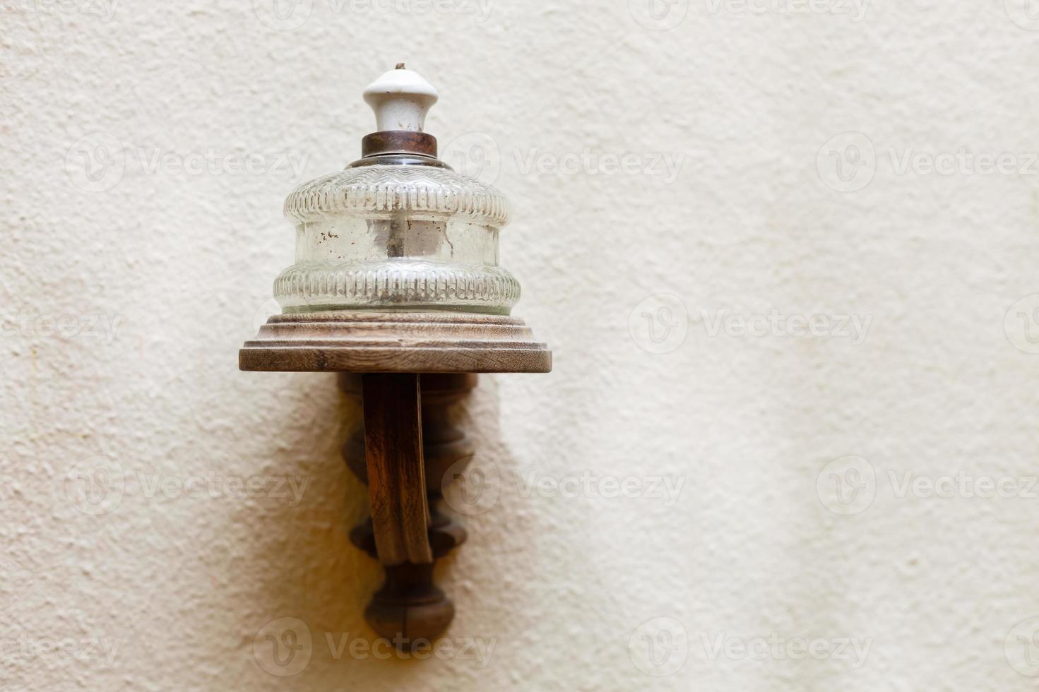 street lamp in a old wall photo