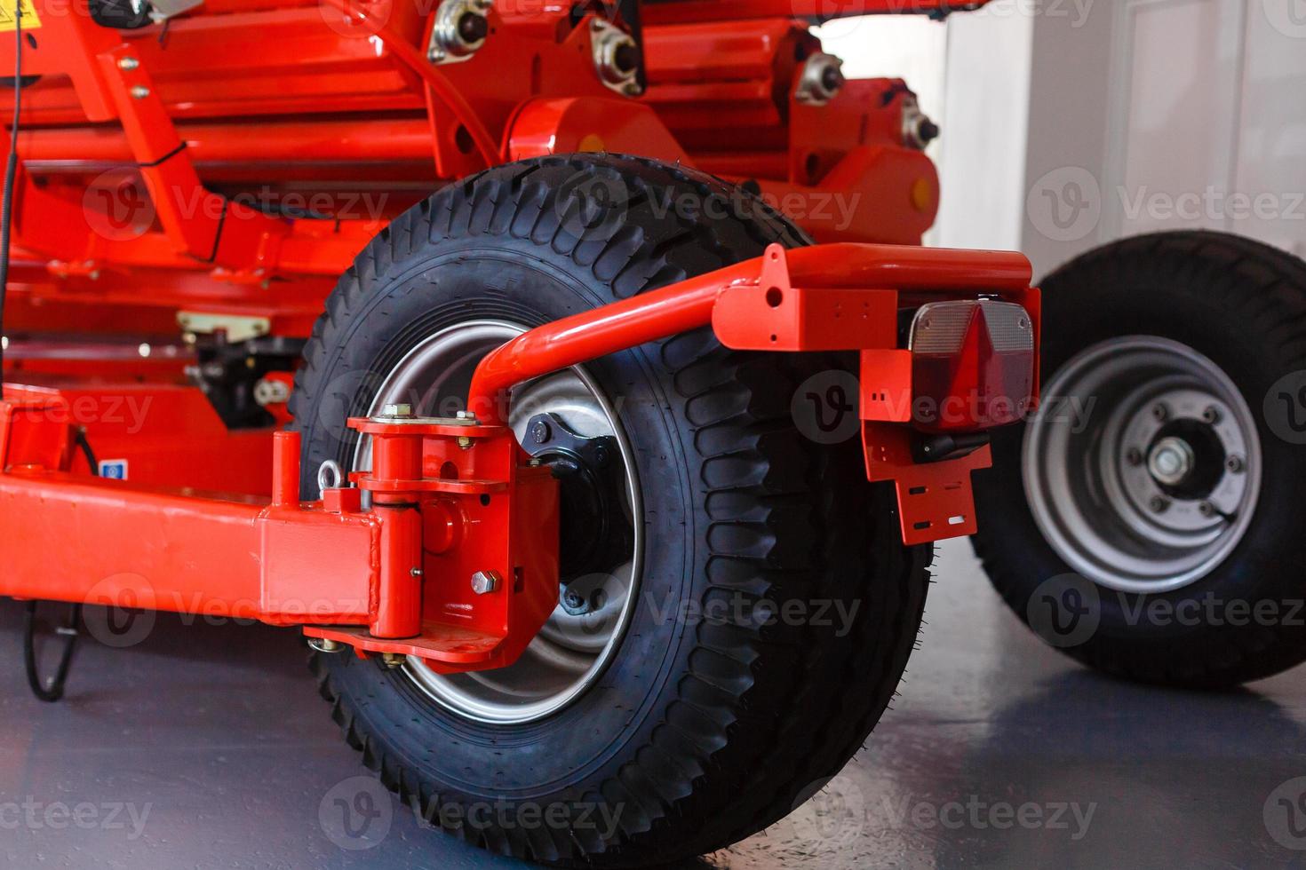 Close up of pipe system of hydraulic valves in agricultural machinery photo