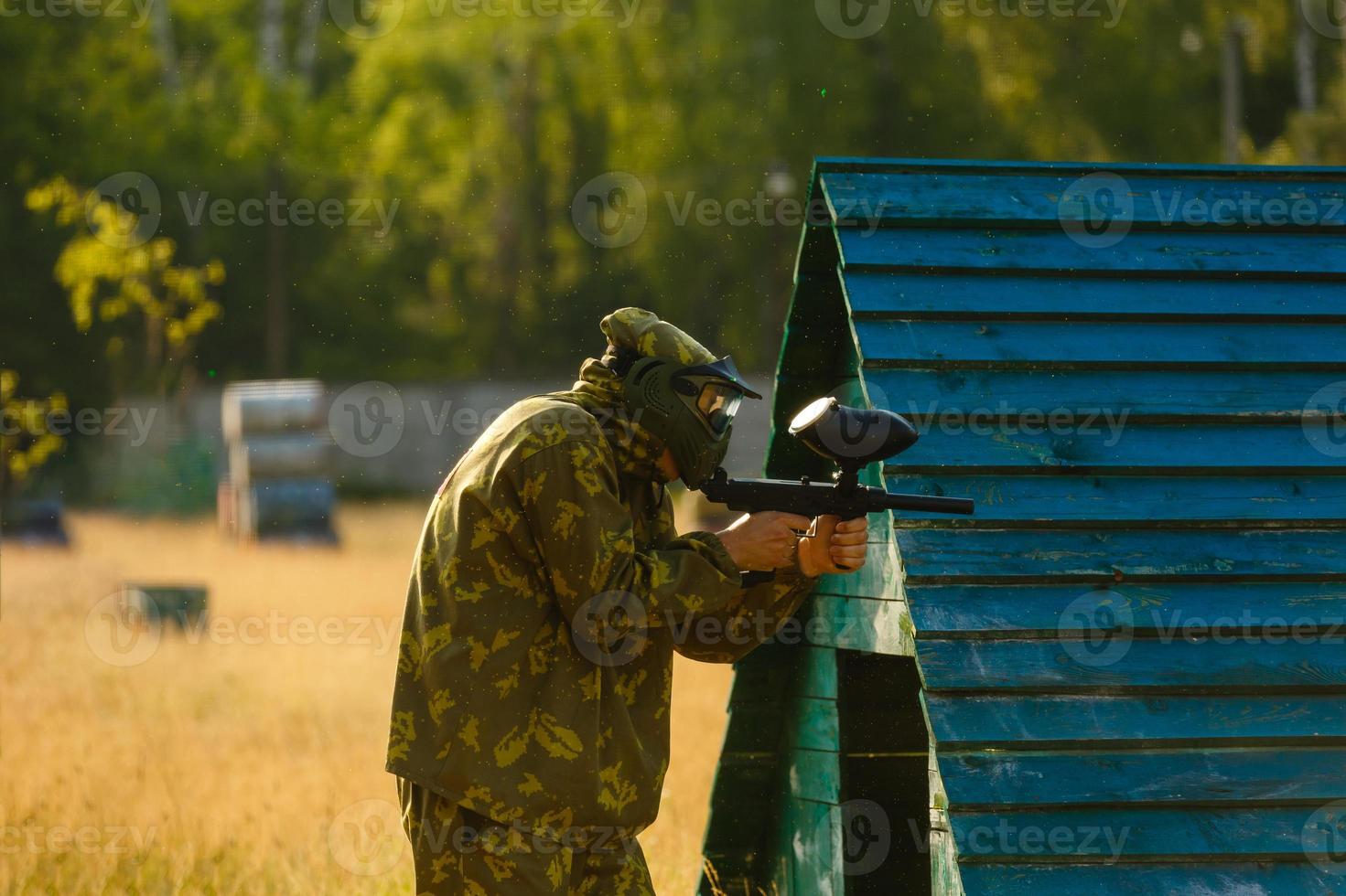 Paintball player aiming photo