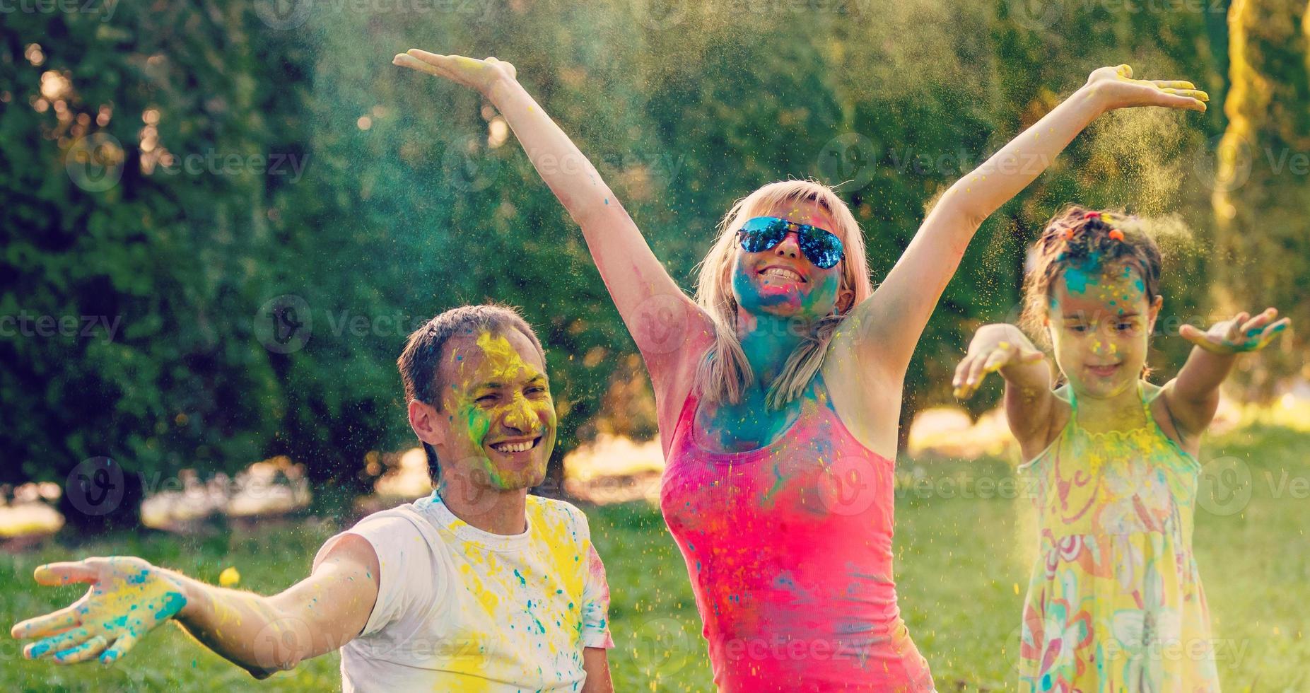 Happy family with paint. Concept of friendly family. photo