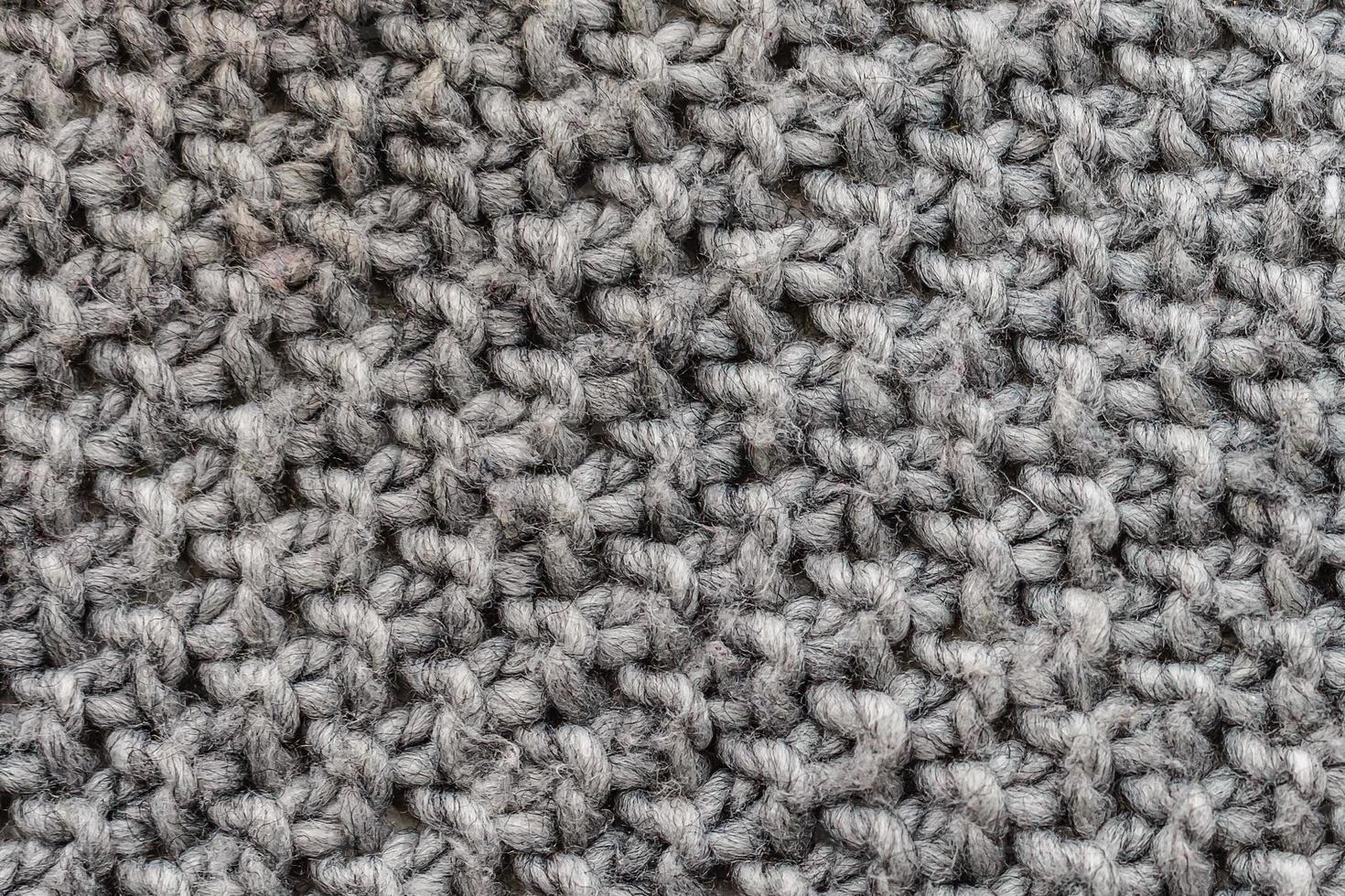 the texture of the netting of large threads grunge fabric gray photo