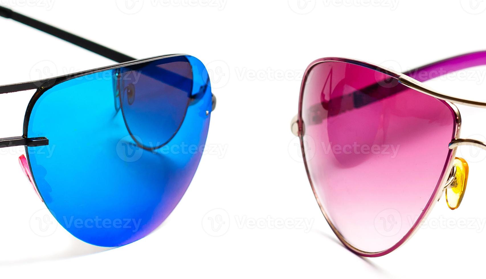 Group of beautiful sunglasses isolated on white background photo