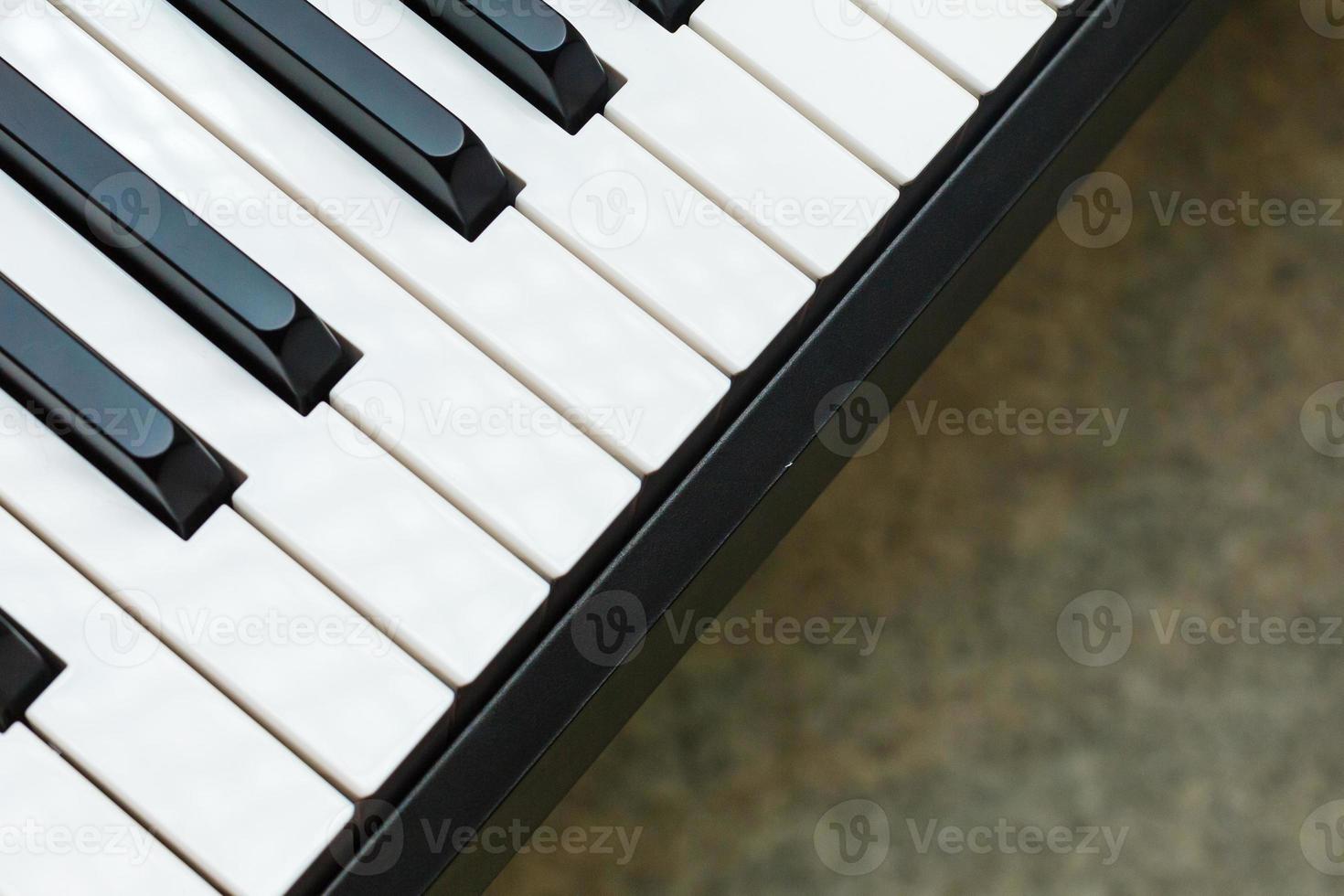 Black and white piano keys with written notes top view the concept of music photo