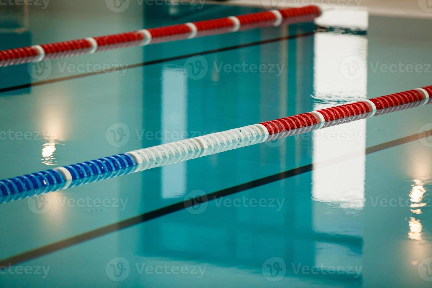 The view of an empty public swimming pool indoors lanes of a competition swimming pool sport photo