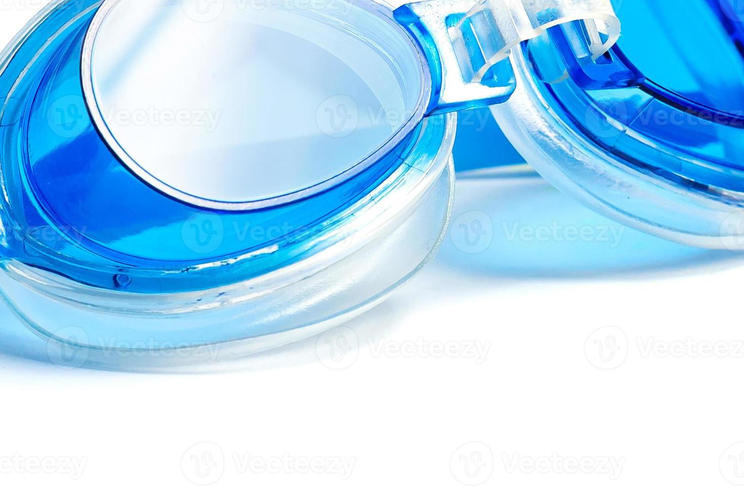 Blue swimming goggles isolated on white background photo