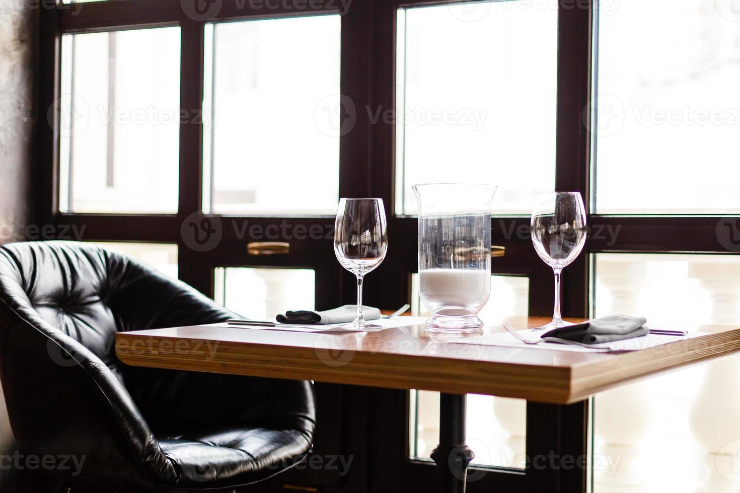 Empty glasses set in restaurant photo