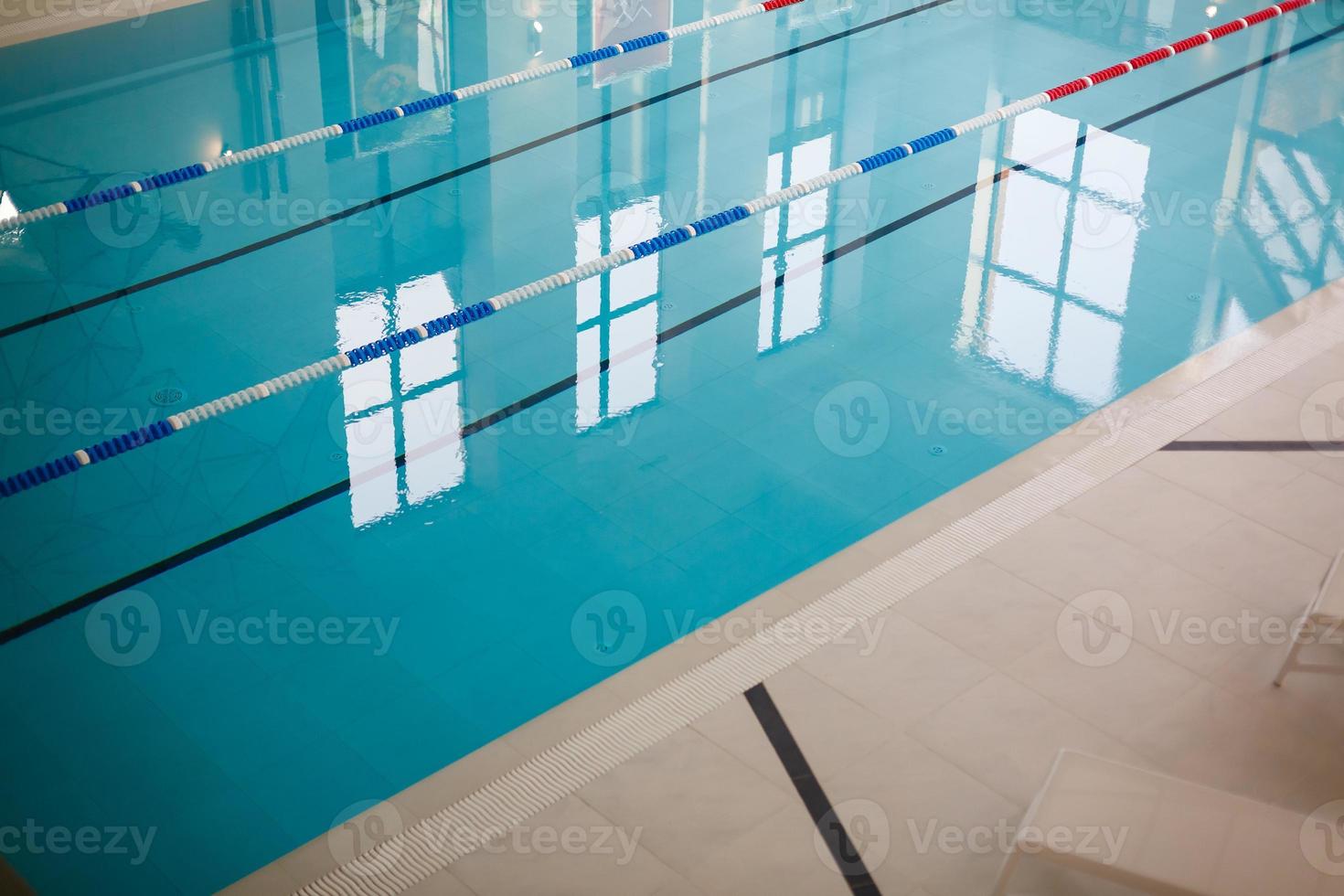 Empty pool with sun loungers photo