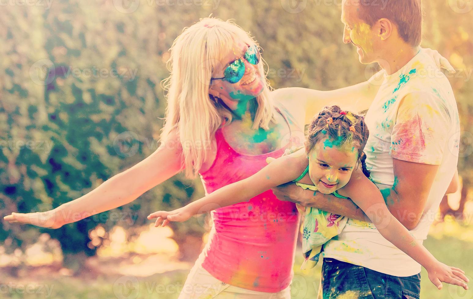 Happy family with paint. Concept of friendly family. photo