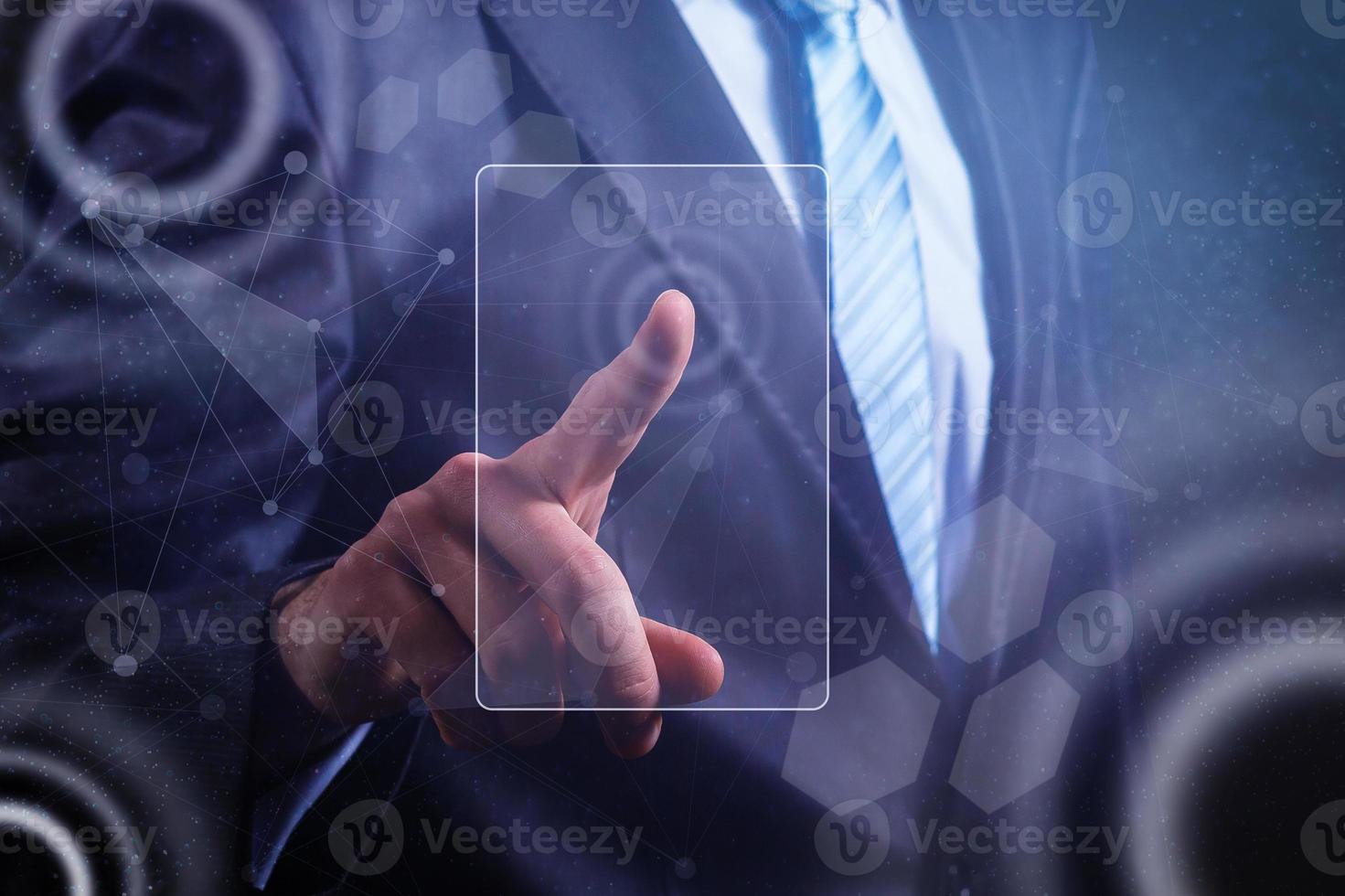 Close up of businessman touching digital screen with finger photo