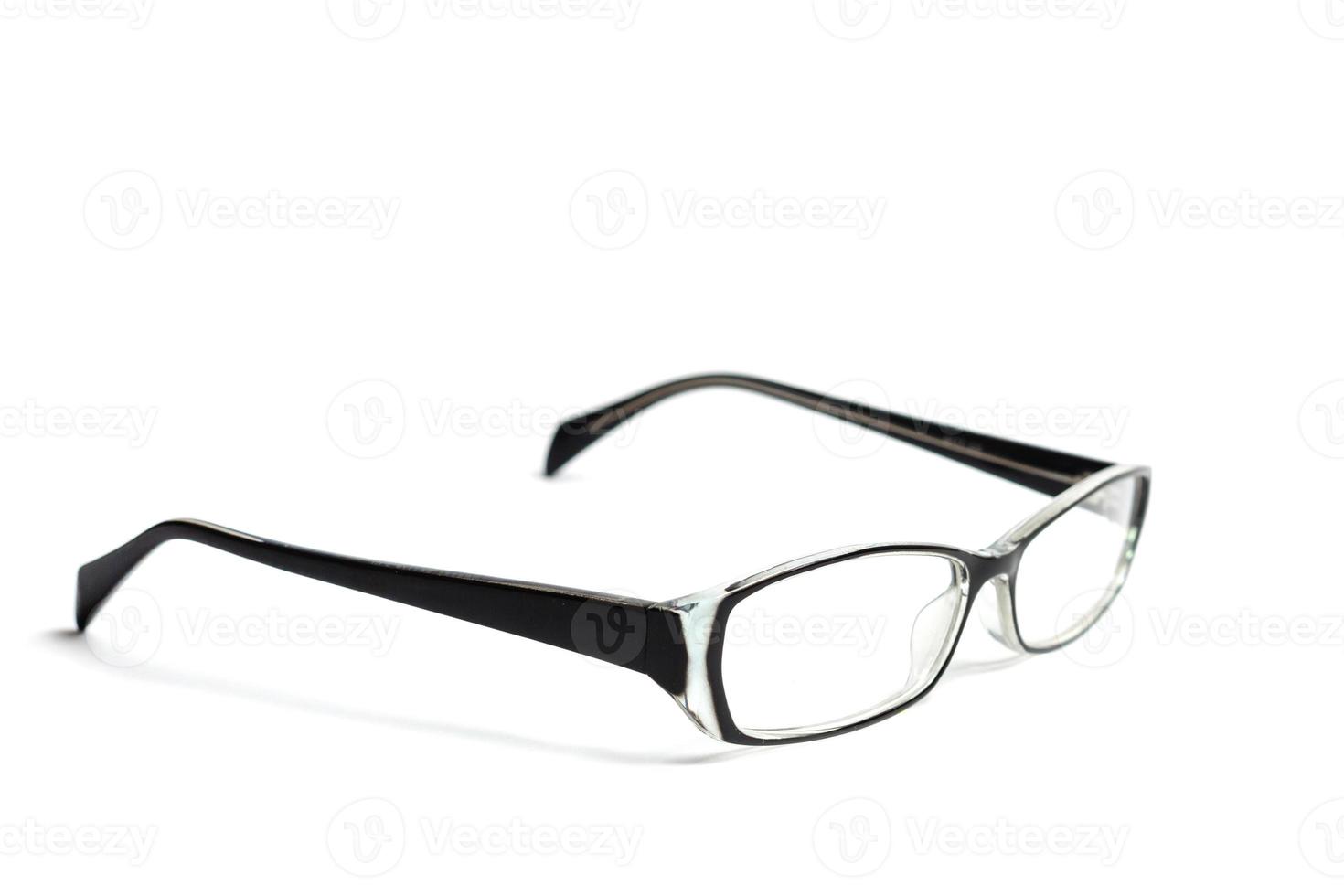 Transparent glasses for correction of sight isolated on white background photo
