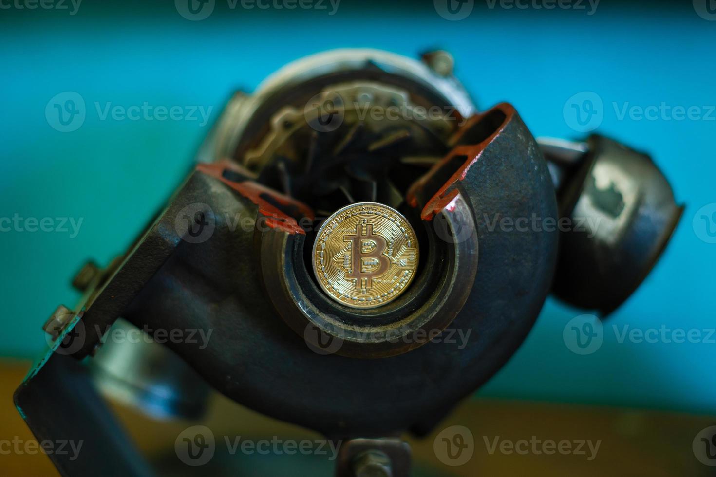 Metal gears wheels with bitcoin on a copper background photo
