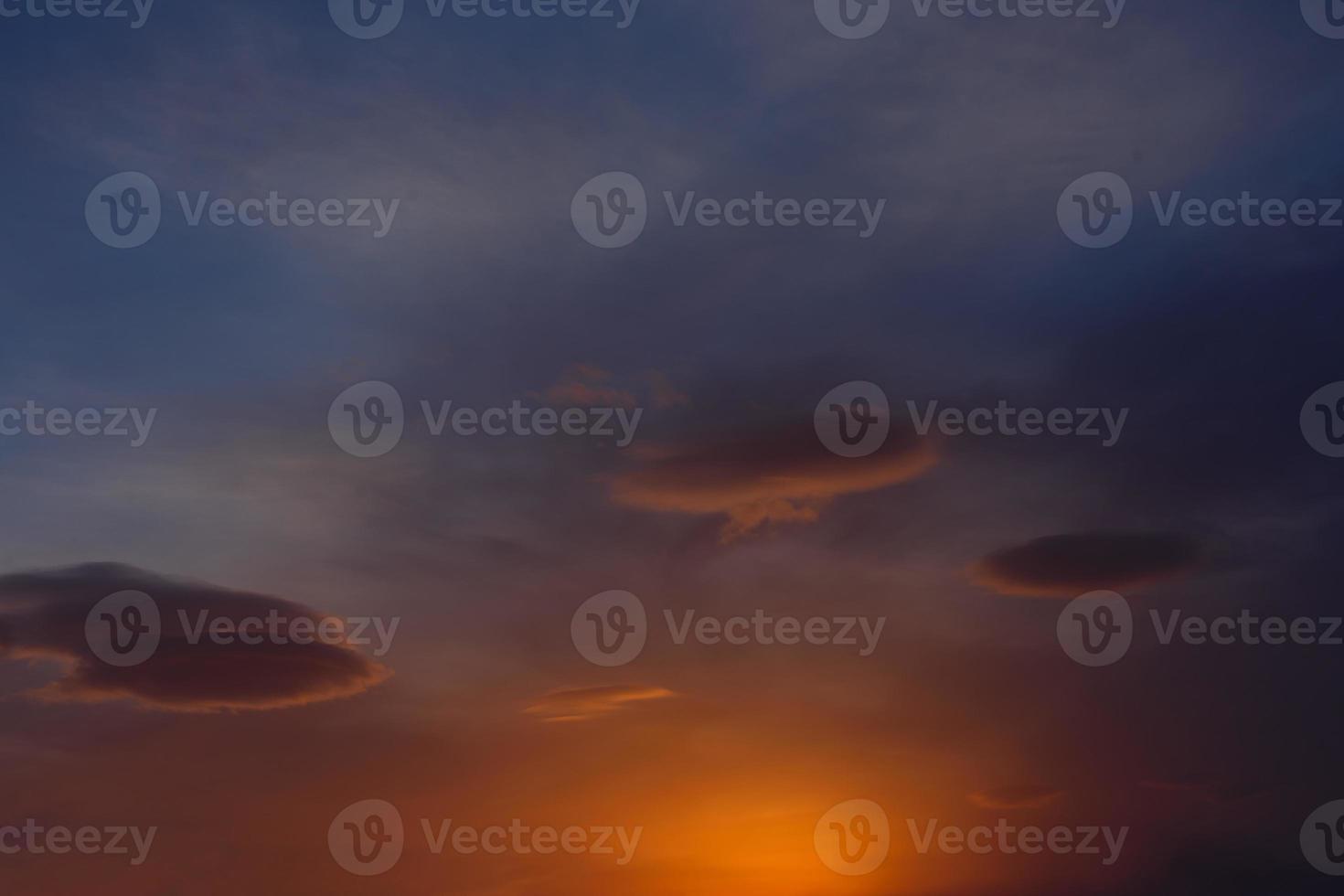 three clouds in the colorful sky photo