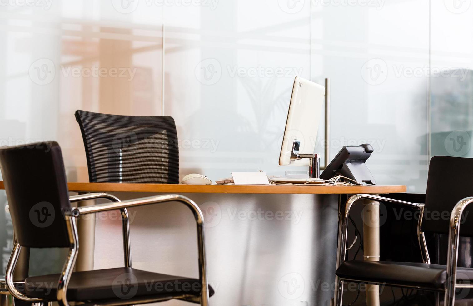 Workplace with notebook laptop Comfortable work table in office windows and city view. photo