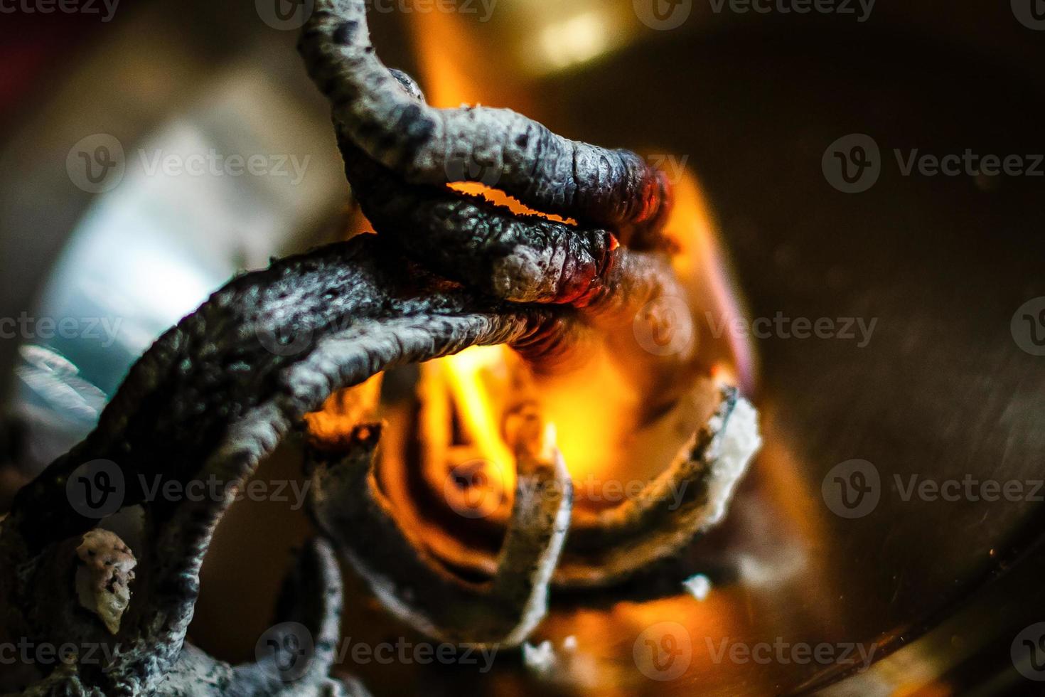 Fire on sticks wood for burning charcoal in stove preparing photo