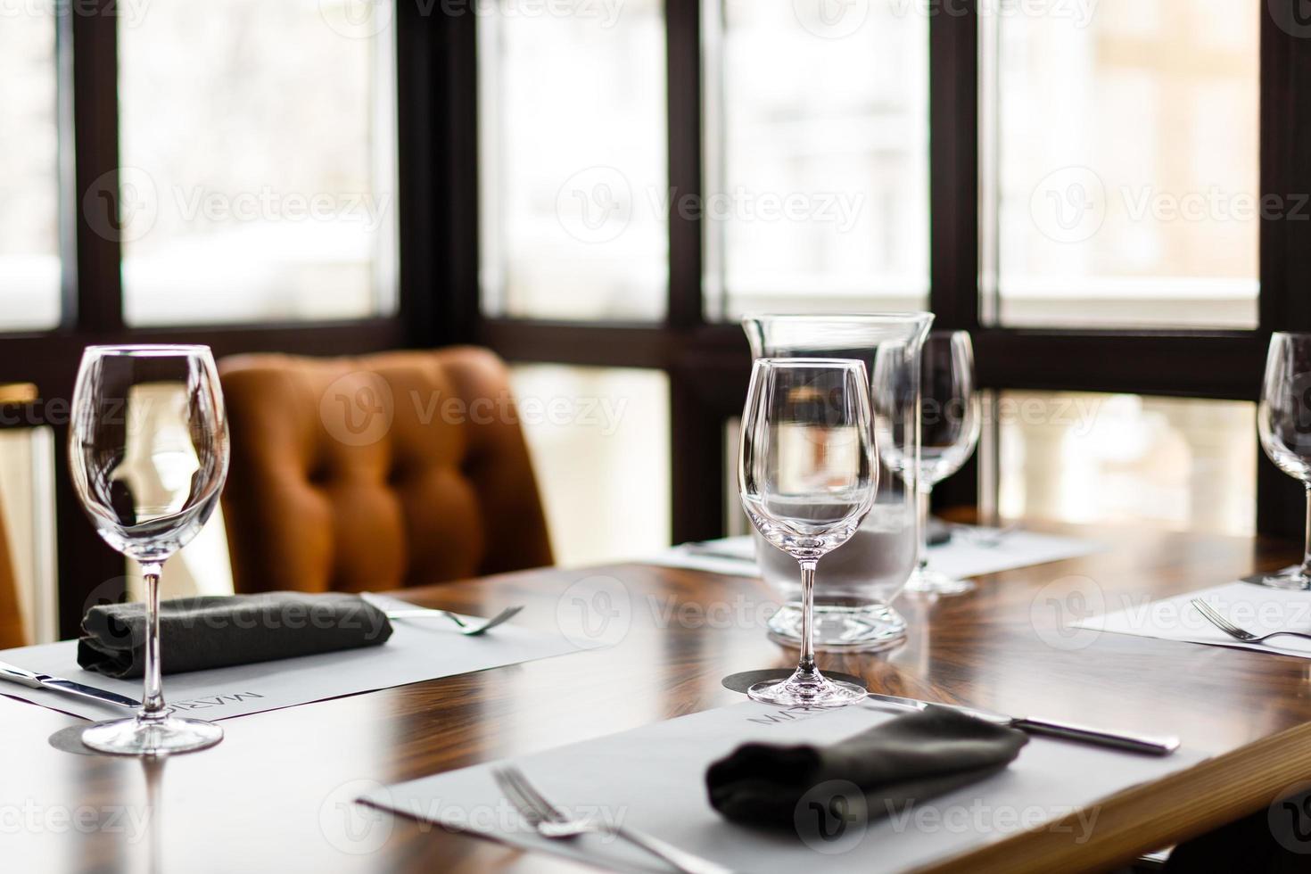 Empty glasses set in restaurant photo