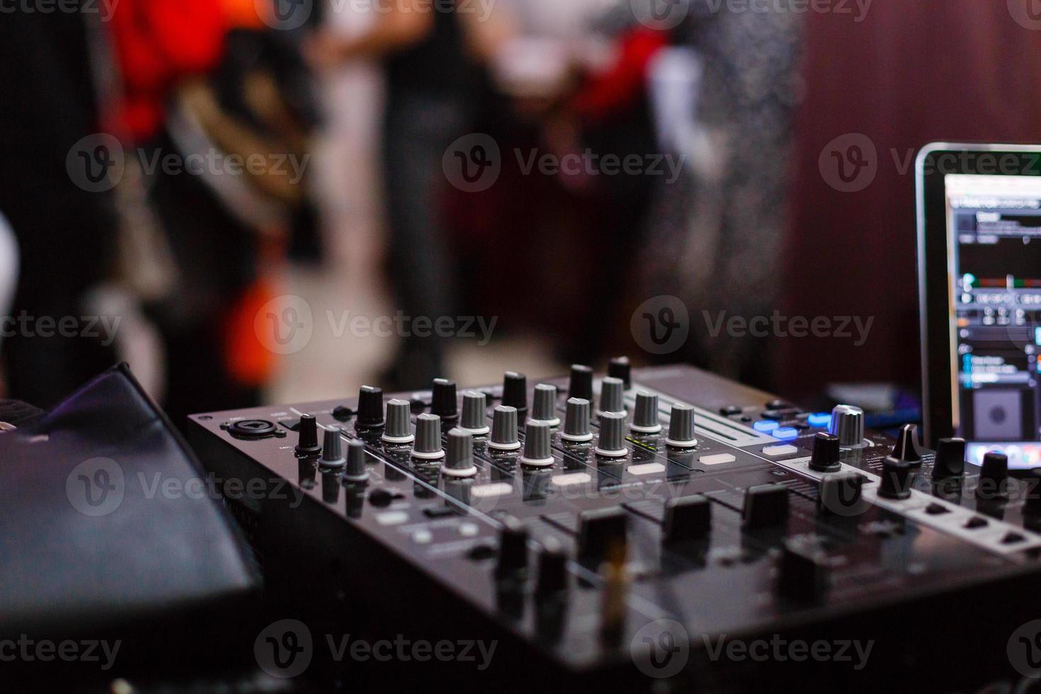 Close up of music controls buttons of studio mixer photo