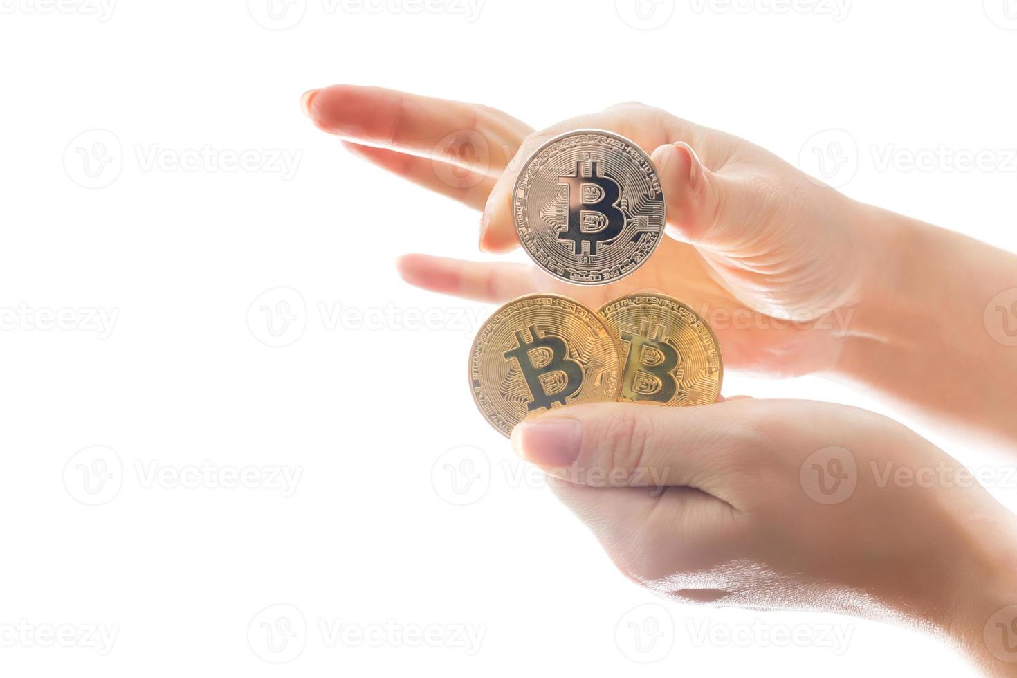 hand holds three coins of digital currency bitcoin photo