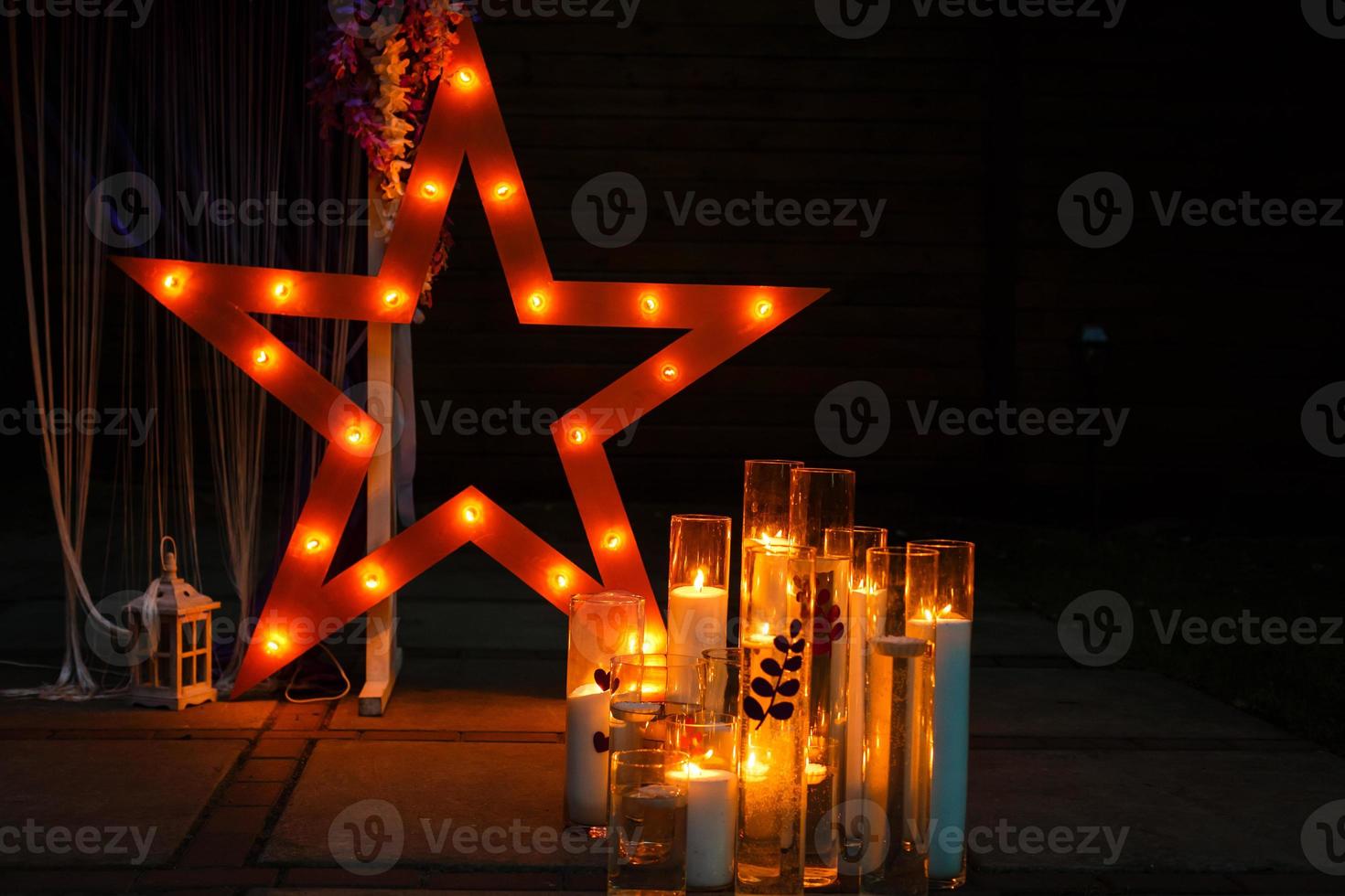 Decorative star with lamps on a background of wall. Modern grungy interior photo