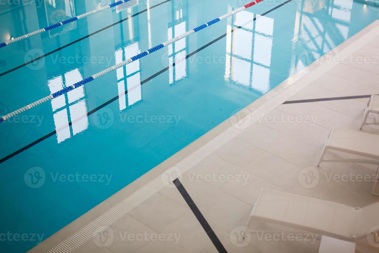 The view of an empty public swimming pool indoors lanes of a competition swimming pool sport photo