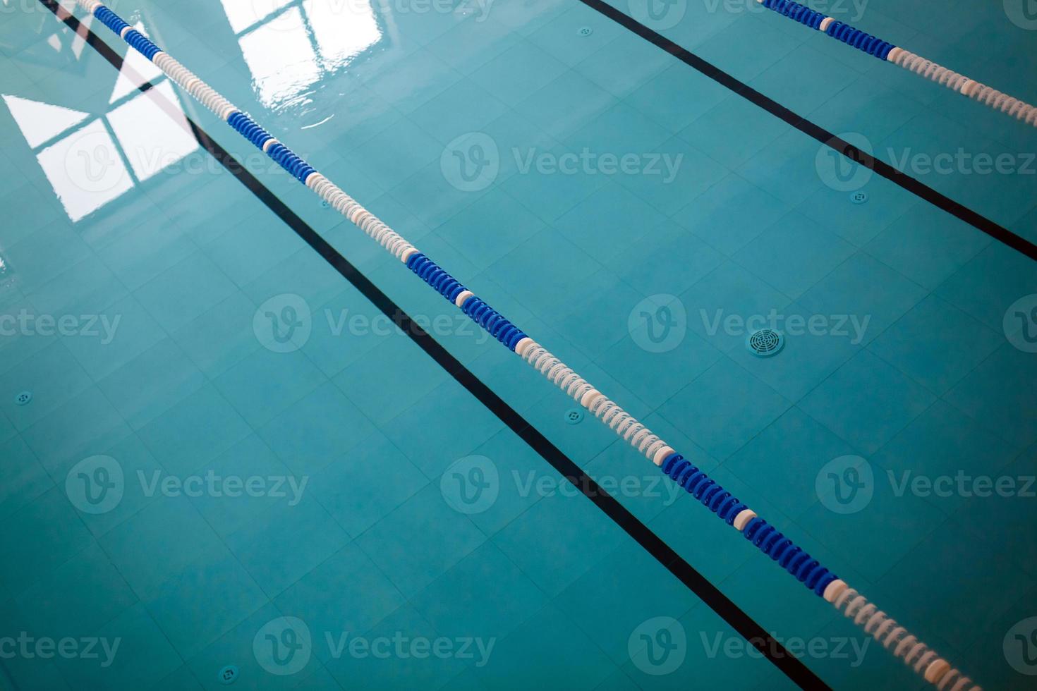 The view of an empty public swimming pool indoors lanes of a competition swimming pool sport photo