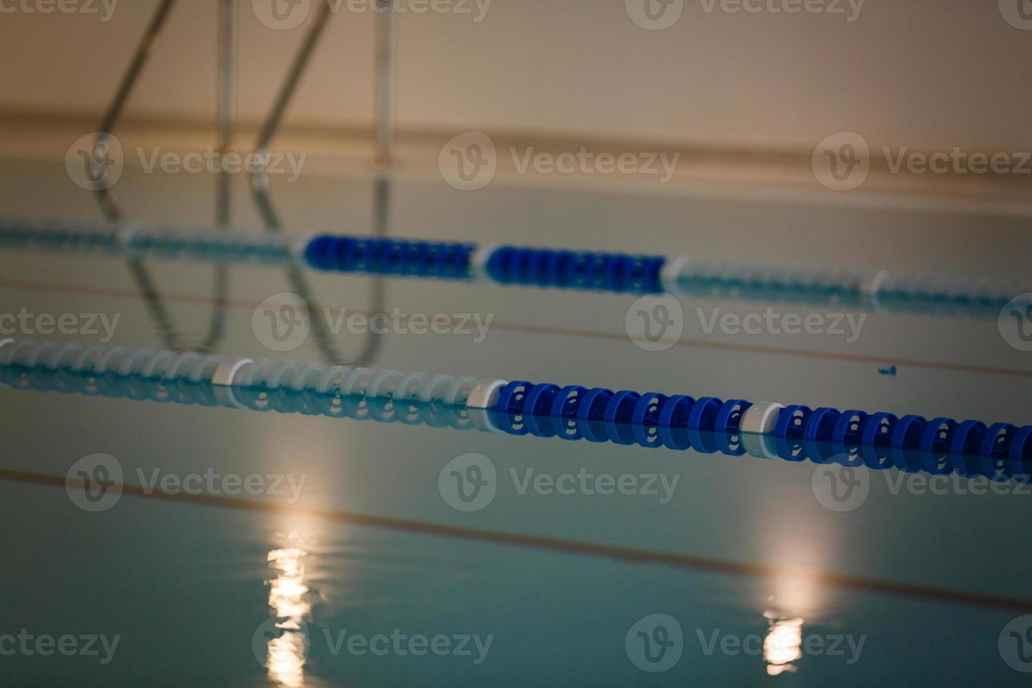 The view of an empty public swimming pool indoors lanes of a competition swimming pool sport photo