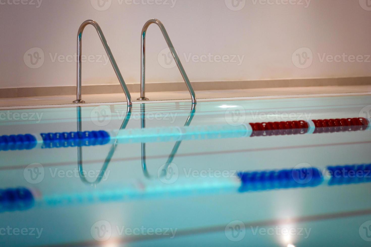 Pool metal stairs close up photo