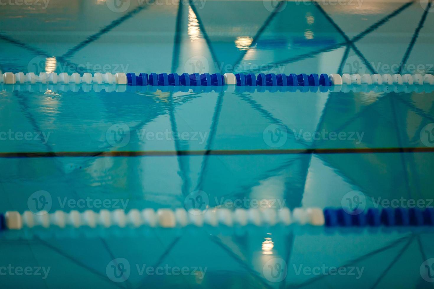 The view of an empty public swimming pool indoors lanes of a competition swimming pool sport photo