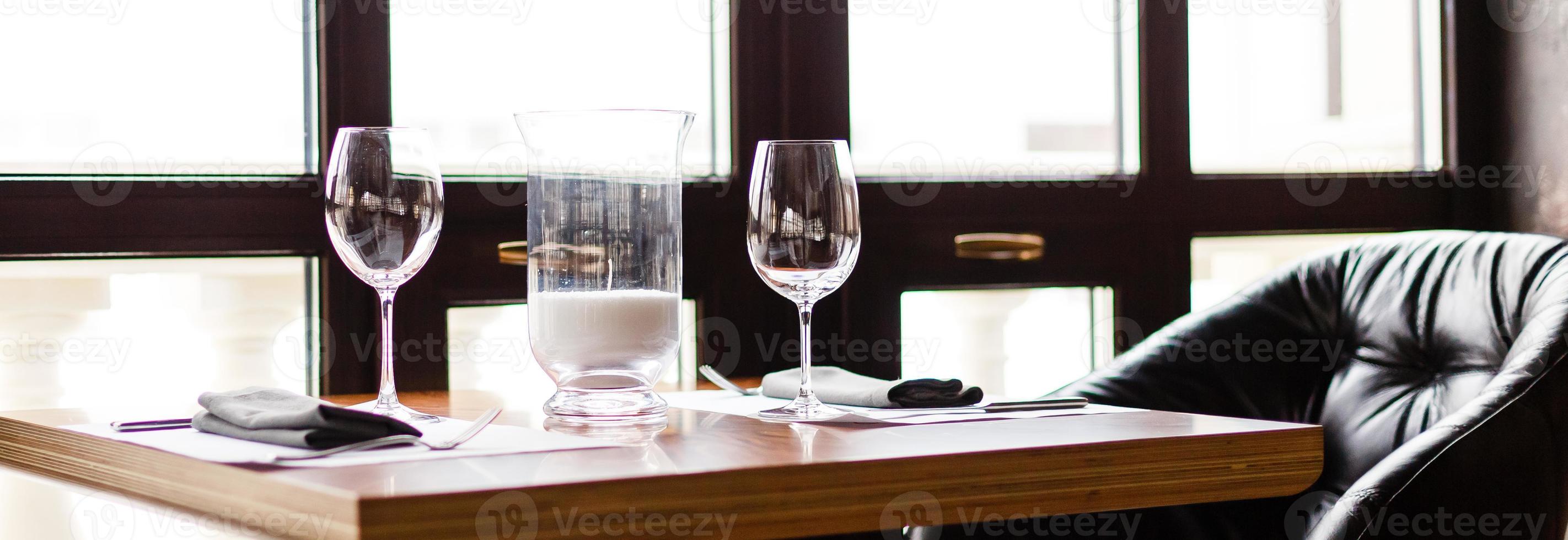Empty glasses set in restaurant photo