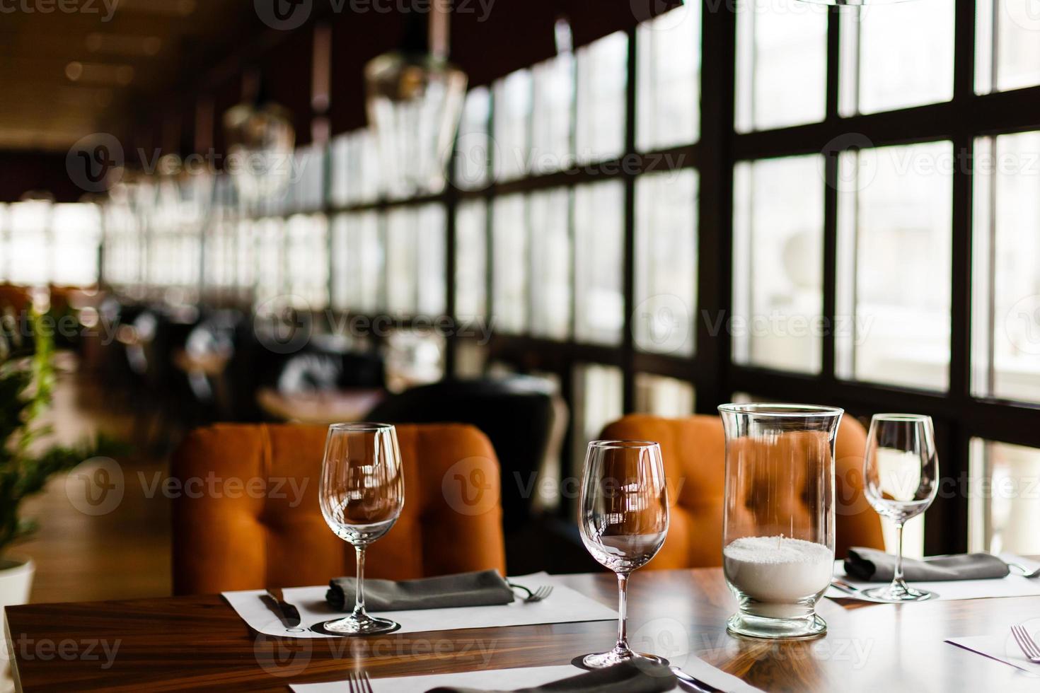 Empty glasses set in restaurant photo