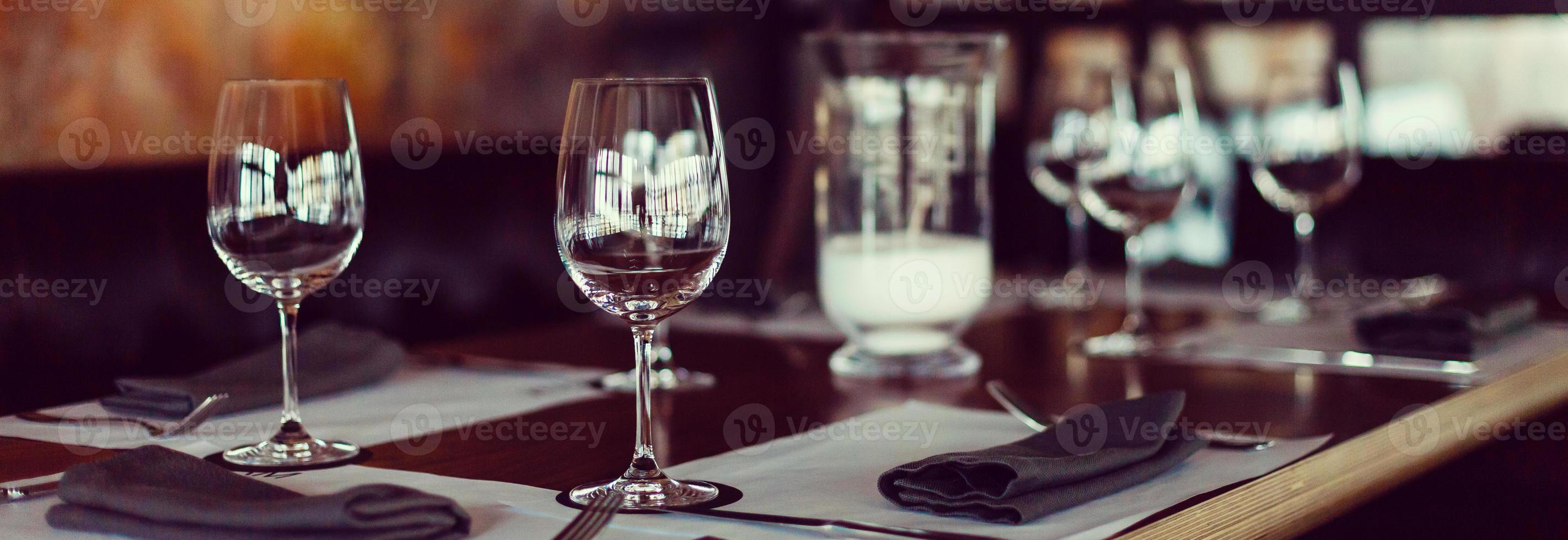 Empty glasses set in restaurant photo