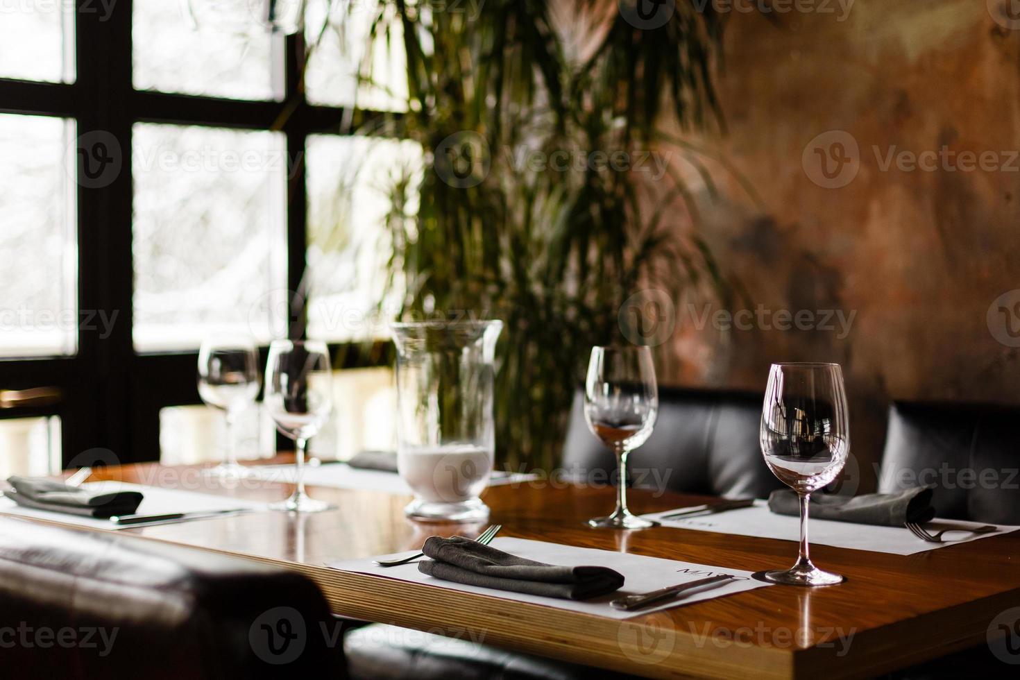 Empty glasses set in restaurant photo