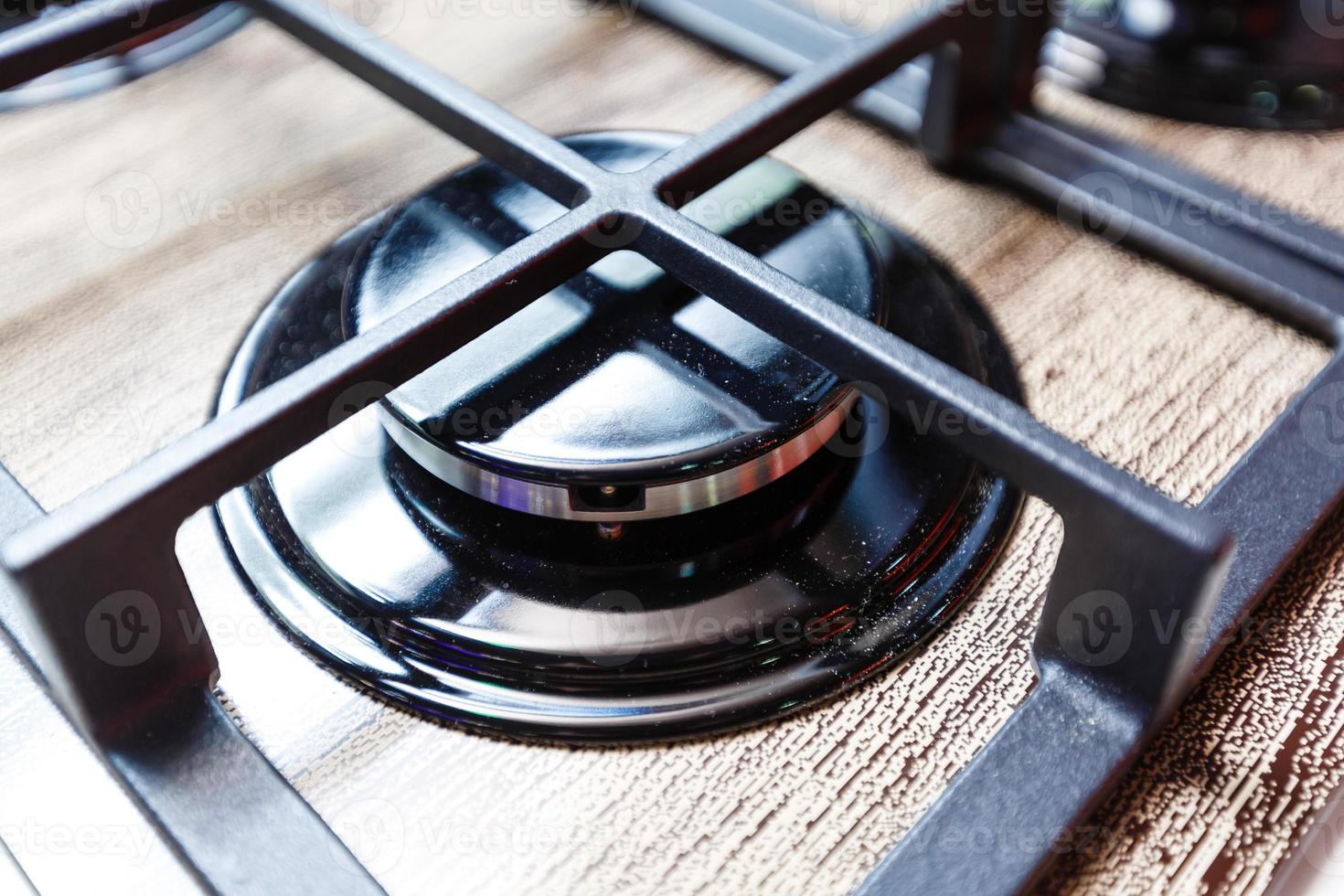 Dirty gas stove burners in kitchen room, close-up shooting. photo