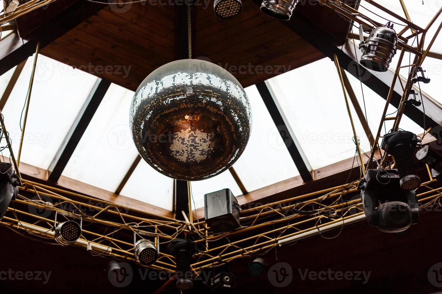 Disco ball light reflection background in night clubs photo