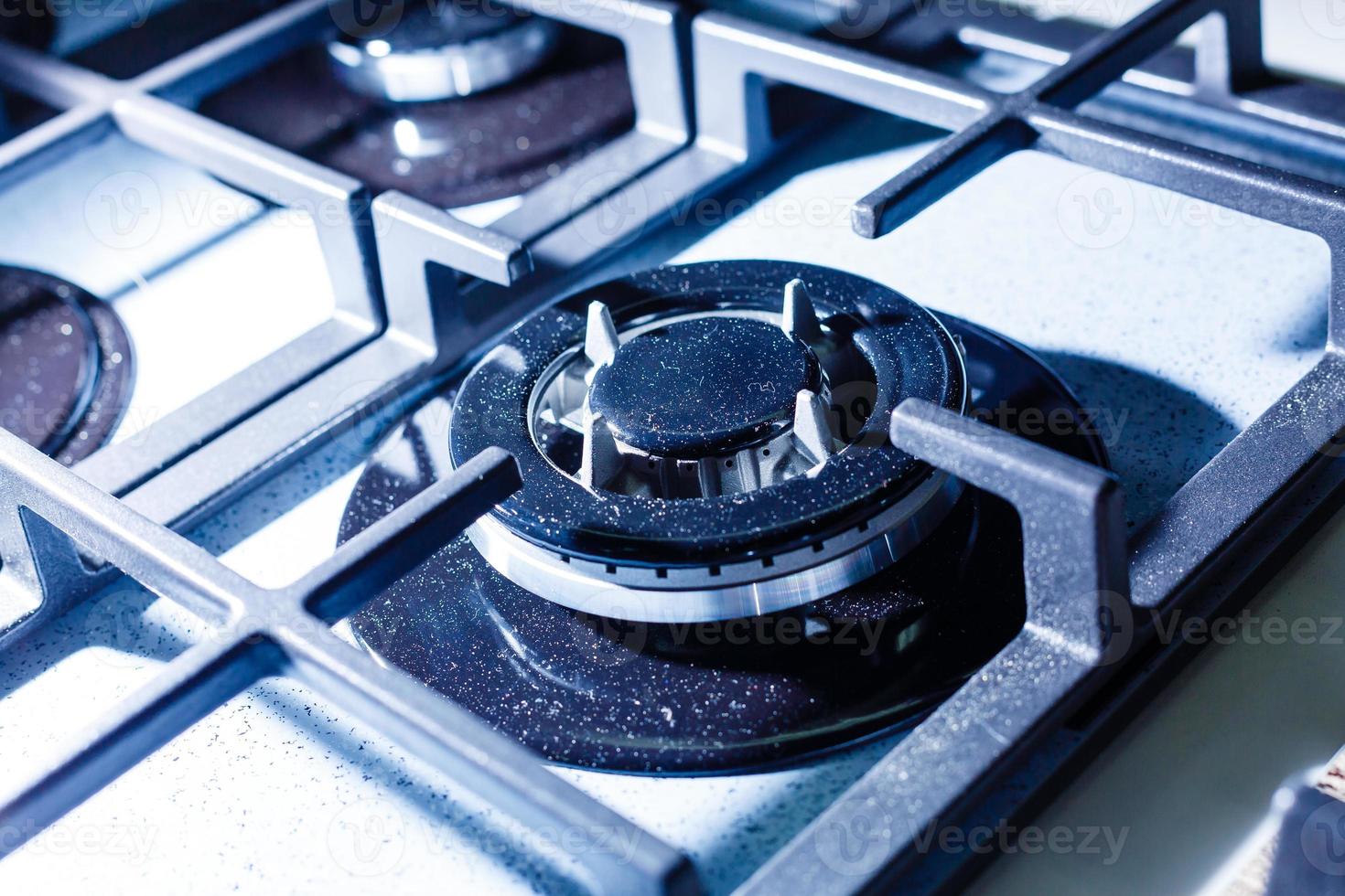 Dirty gas stove burners in kitchen room, close-up shooting. photo