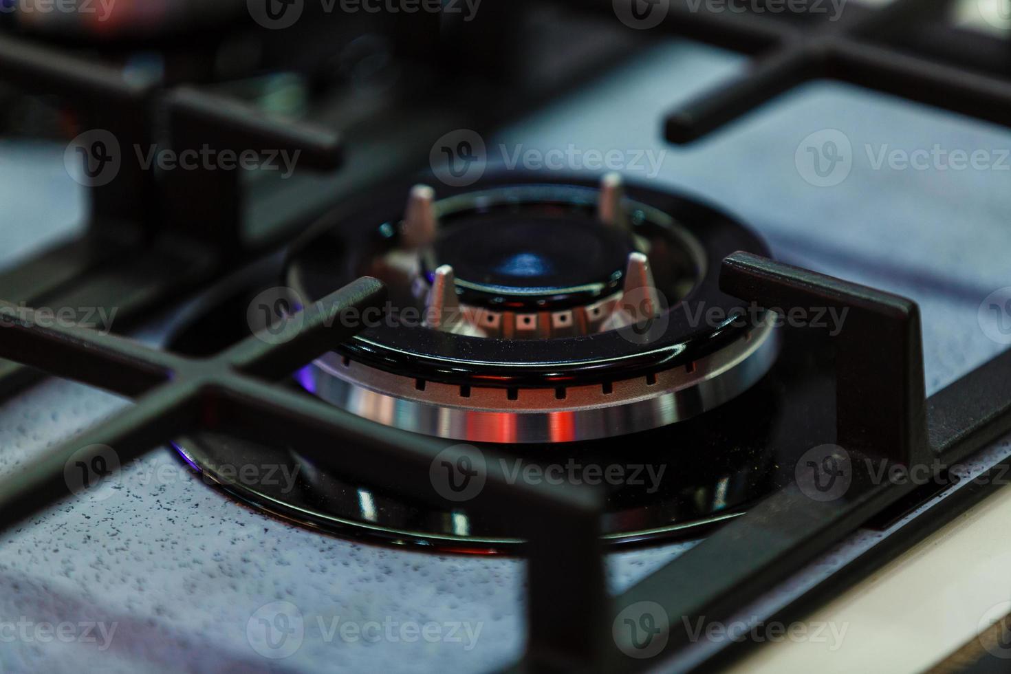 Dirty gas stove burners in kitchen room, close-up shooting. photo