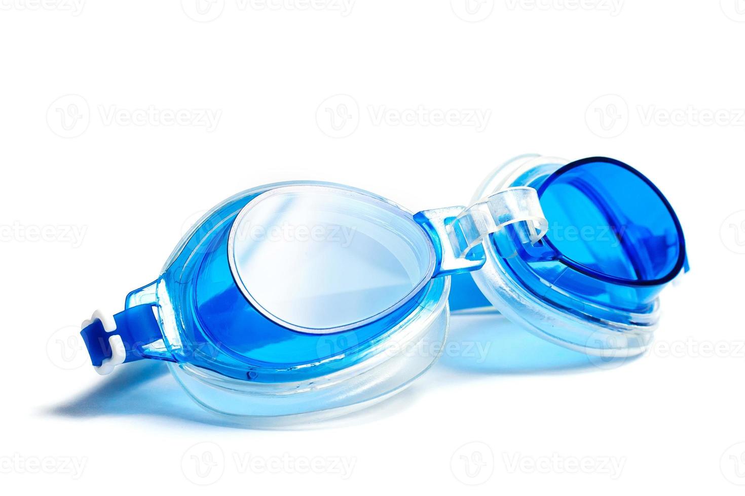 Blue swimming goggles isolated on white background photo