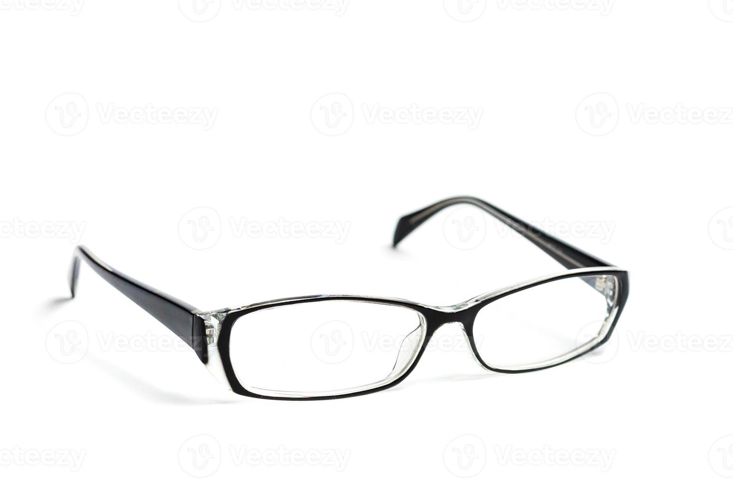 Transparent glasses for correction of sight isolated on white background photo
