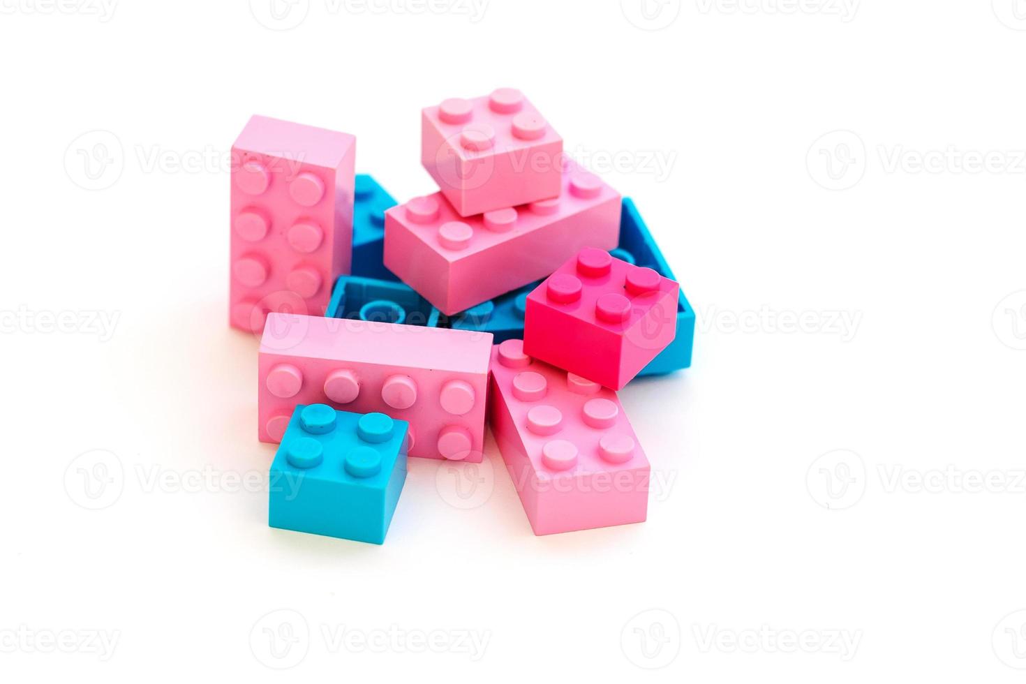 Toy building colorful blocks on white background photo