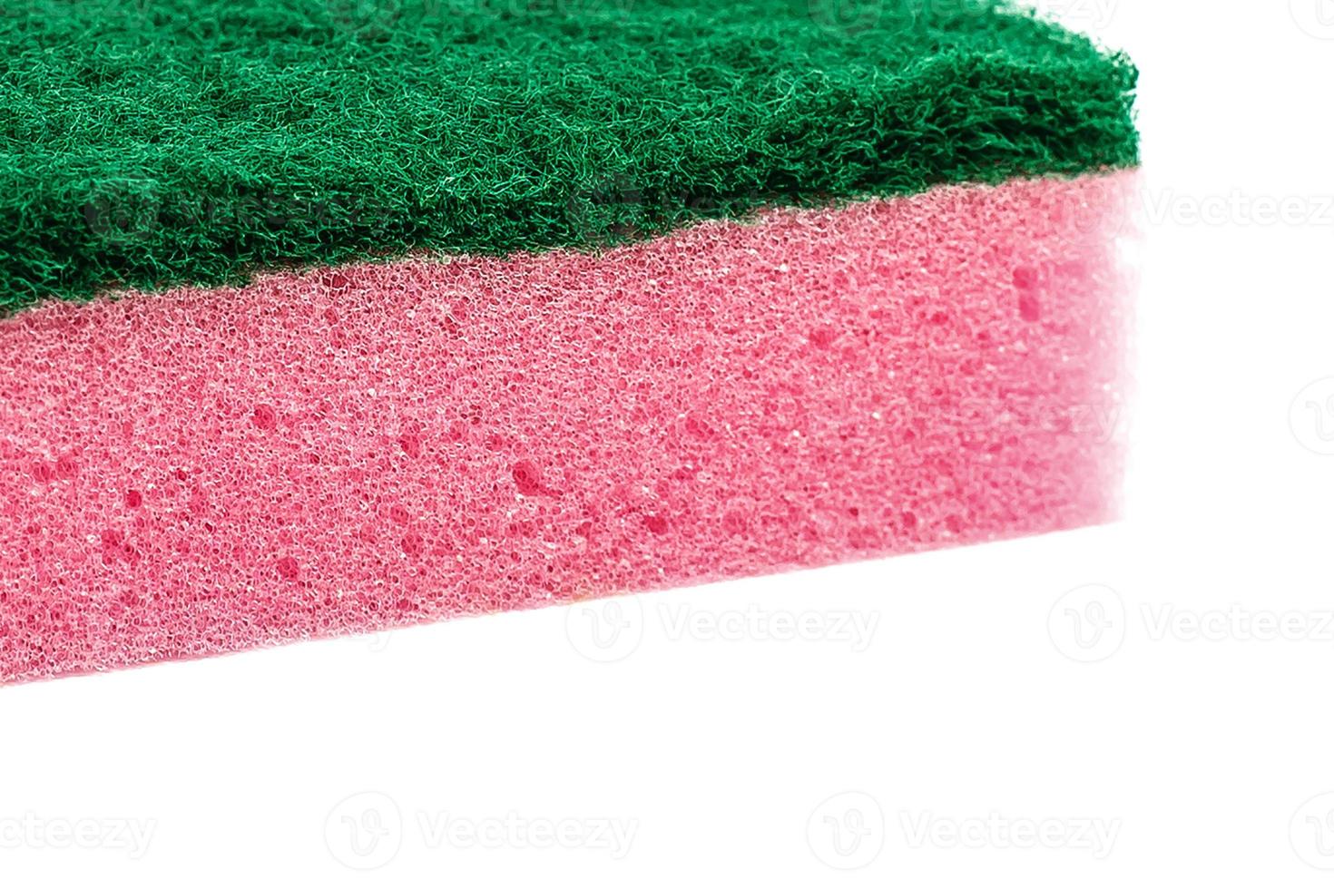 Pink sponge on white isolated background photo