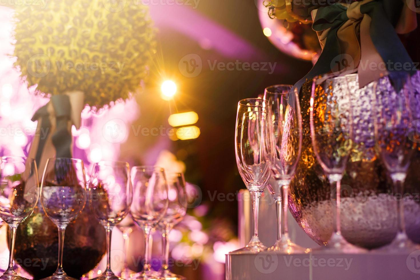 Wine glasses in row on bar photo