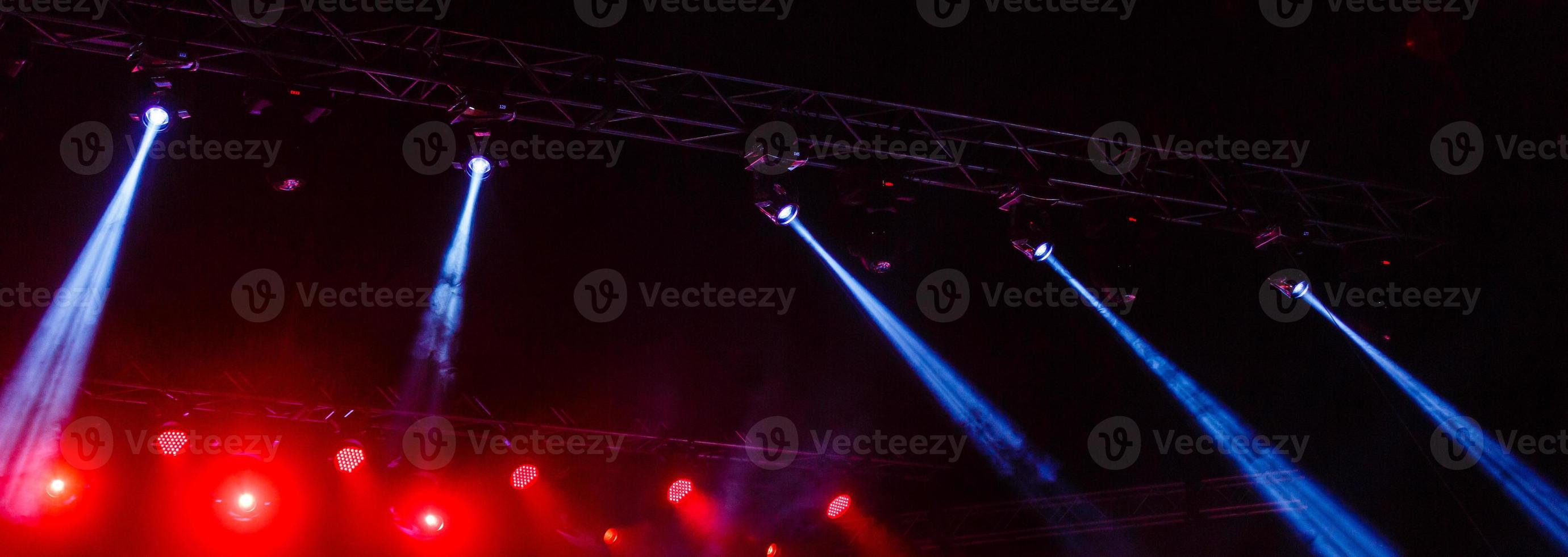 Illuminated empty concert stage with smoke photo