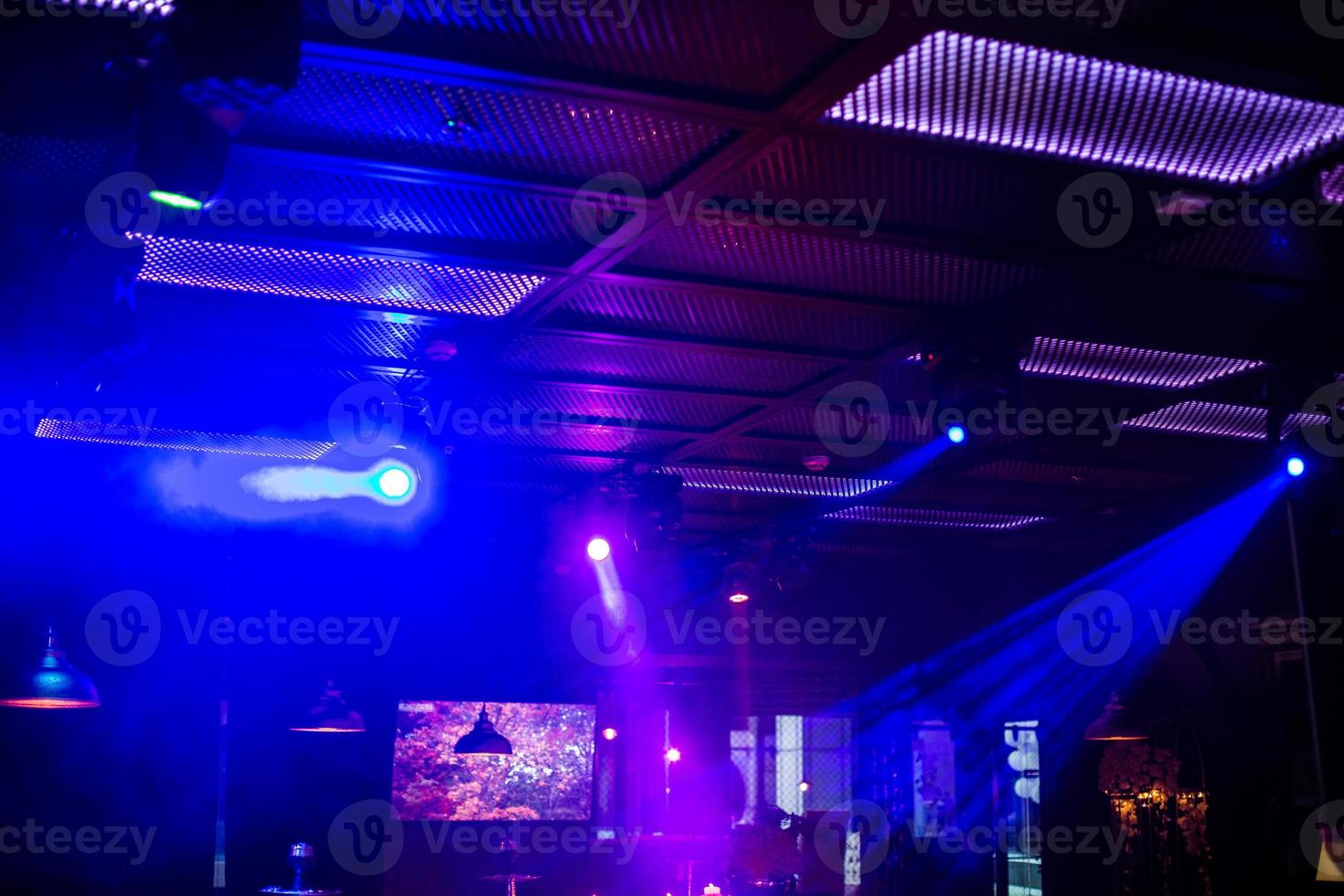 Concert stage. Beautiful Colorful disco lighting in the stage. Performance moving lighting. Concert Light Show. Stage Lights. photo