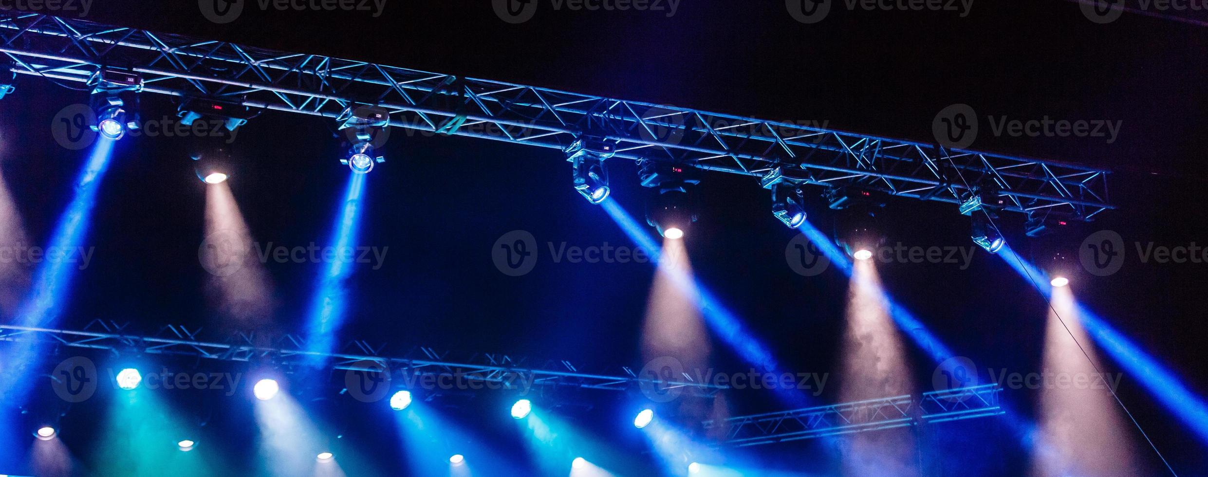 Illuminated empty concert stage with smoke photo