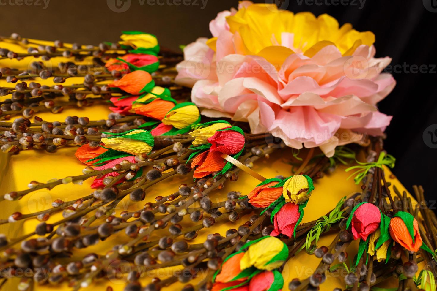 Origami bright colored tulip flowers on a yellow background photo
