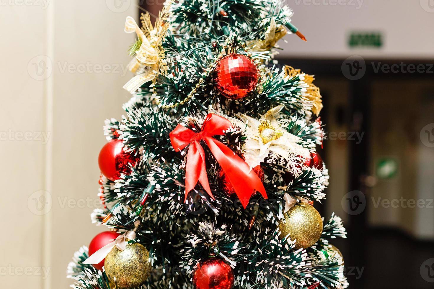 Christmas tree background and Christmas decorations with snow, blurred, sparking, glowing. Happy New Year and Xmas theme photo